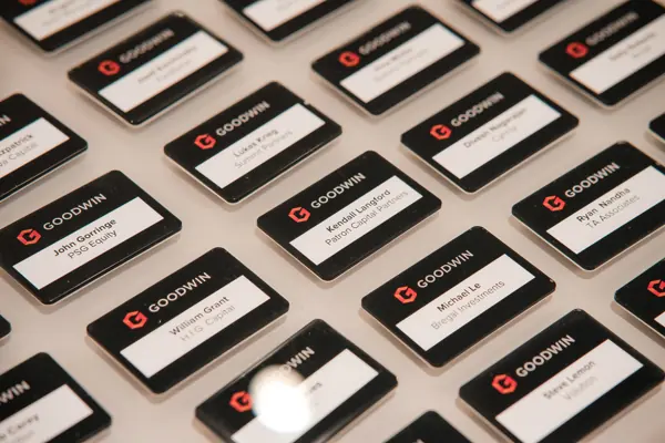 Goodwin name badges prepared for attendees at Goodwin — Management Incentives in the AI Era