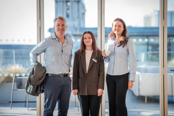 Three guests pictured together by the windows at Goodwin — Management Incentives in the AI Era