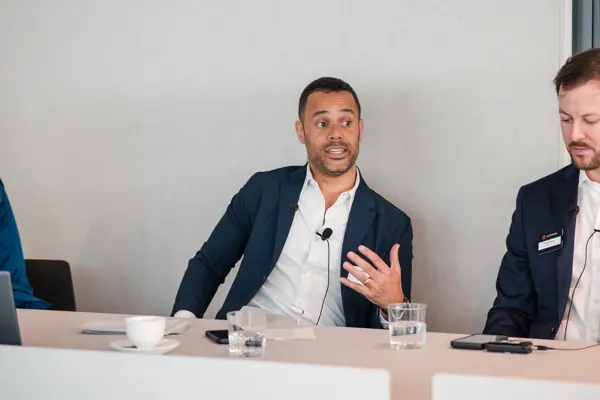 A panel guest explaining a point to the audience at Goodwin — Management Incentives in the AI Era