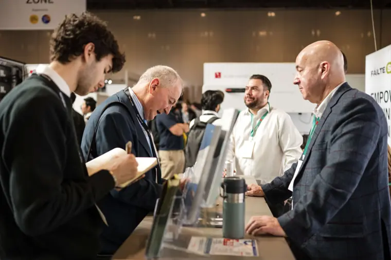 Visitors and the team talking around a product display at Fáilte Solar at Solar & Storage