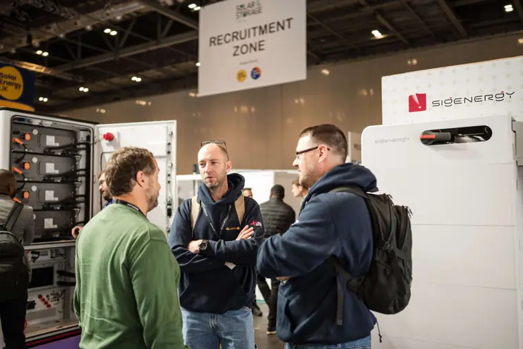 Visitors and exhibitors in conversation at Fáilte Solar at Solar & Storage
