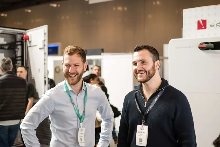Two attendees pictured together at the exhibition at Fáilte Solar at Solar & Storage