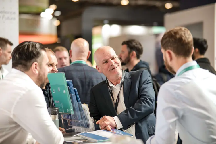 Visitors talking with the Fáilte Solar team at the stand at Fáilte Solar at Solar & Storage