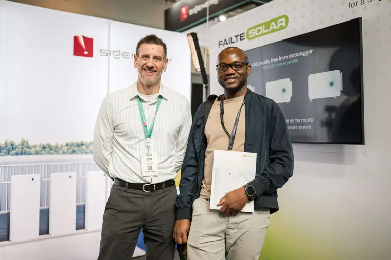 Two guests pictured beside the product display at Fáilte Solar at Solar & Storage