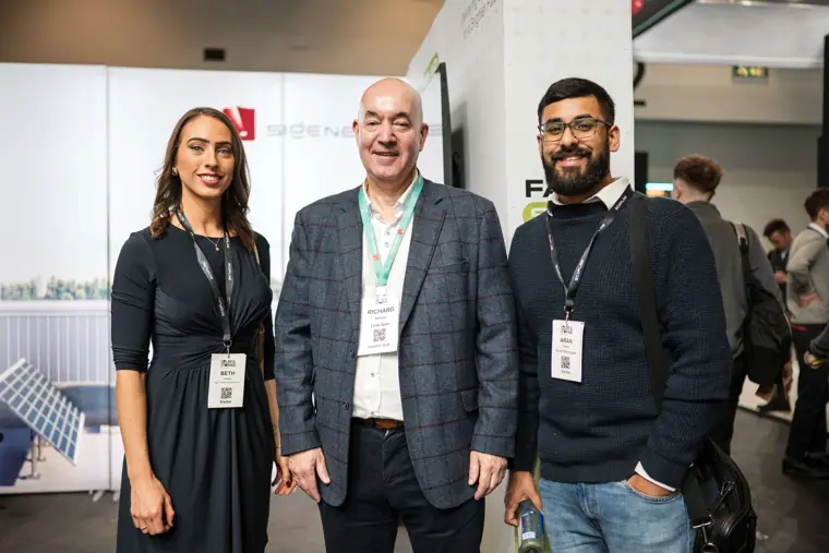 Three attendees pictured together at the Fáilte Solar stand at Fáilte Solar at Solar & Storage
