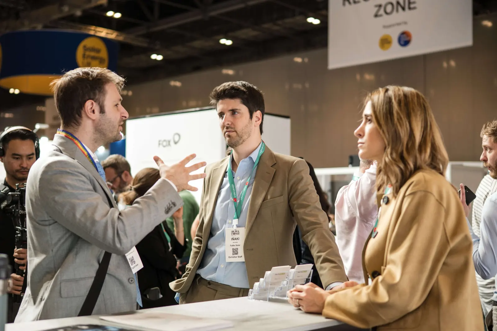An interview conversation beside the technology display at Fáilte Solar at Solar & Storage
