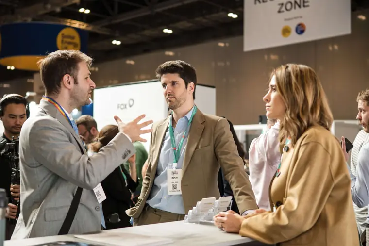 An interview conversation beside the technology display at Fáilte Solar at Solar & Storage