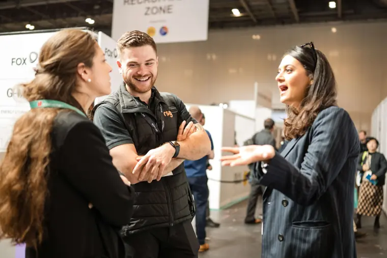Attendees chatting in the exhibition aisle at Fáilte Solar at Solar & Storage