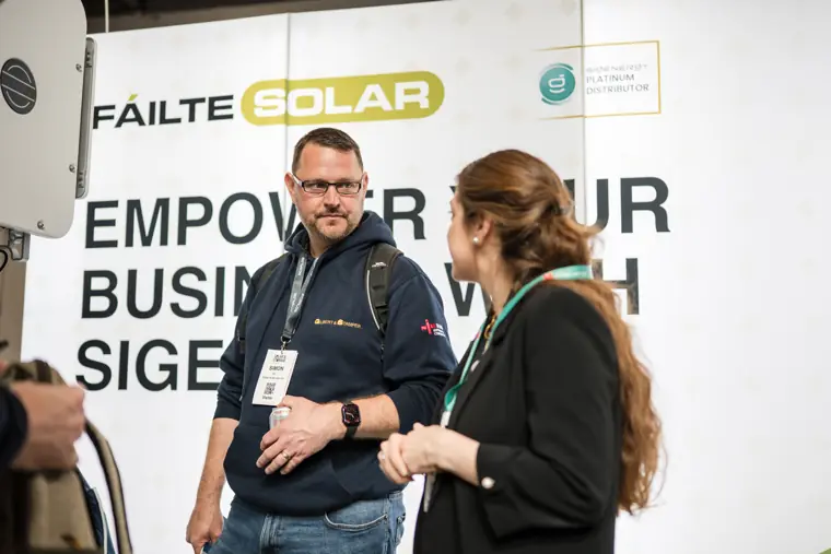 Visitors and exhibitors in conversation at Fáilte Solar at Solar & Storage