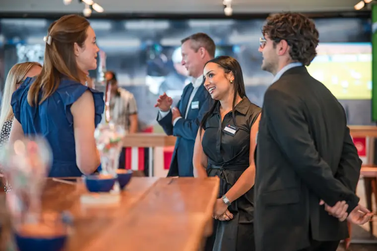 Guests talking across the drinks counter at Goodwin Tavern.