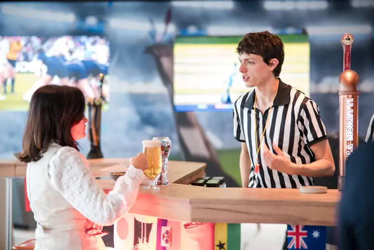 A guest ordering a drink from the bar at Goodwin Tavern.