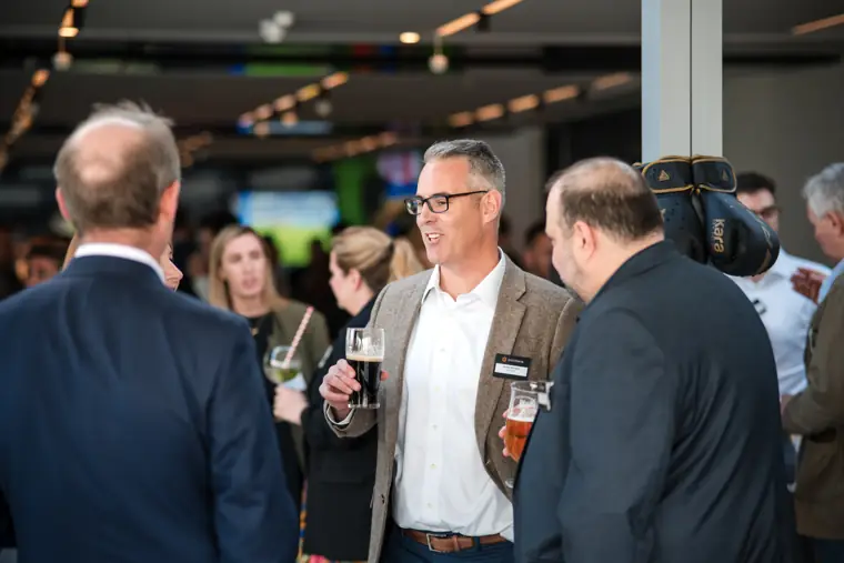 Guests meeting in the busy event room at Goodwin Tavern.