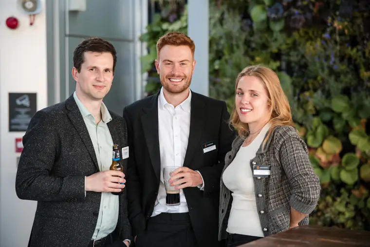 Three guests photographed together at the party at Goodwin Tavern.