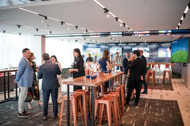 A wide view of guests in the sports-themed room at Goodwin Tavern.