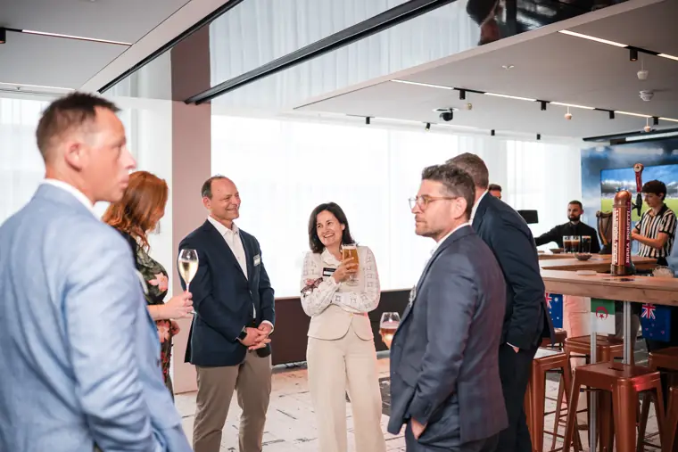 Guests mingling across the room at Goodwin Tavern.