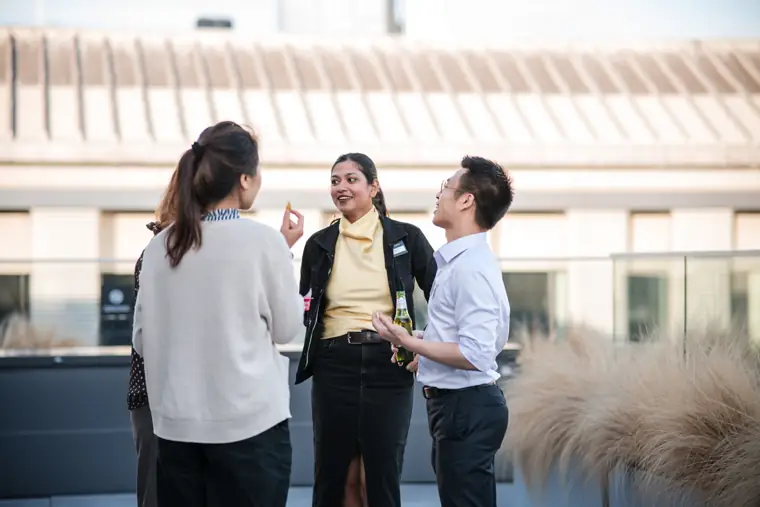 Colleagues chatting on the terrace at Goodwin Tavern.