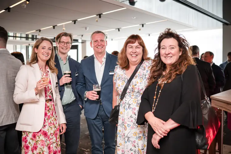 A group of guests enjoying the reception at Goodwin Tavern.