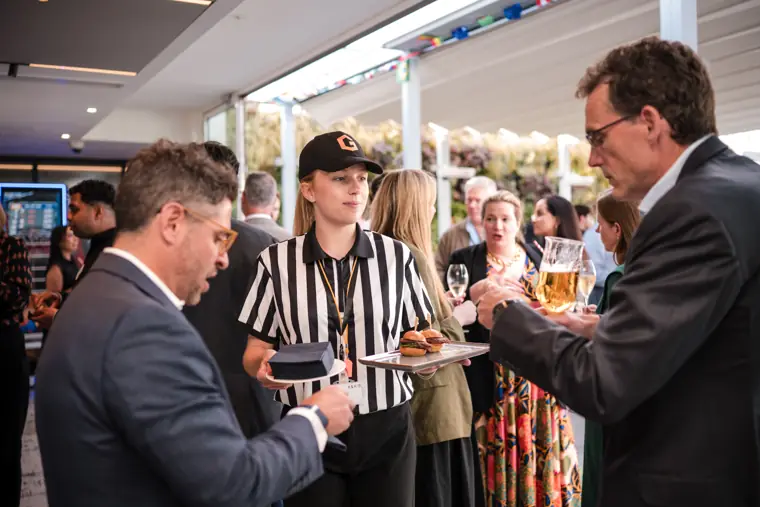 Guests speaking with the event team at Goodwin Tavern.