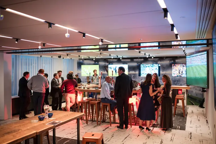 Guests gathered in the sports-themed room at Goodwin Tavern.