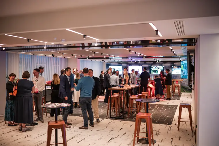 Guests mingling across the room at Goodwin Tavern.