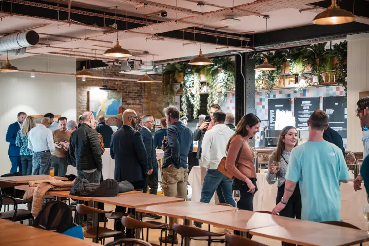 Guests mingling around the open event space.