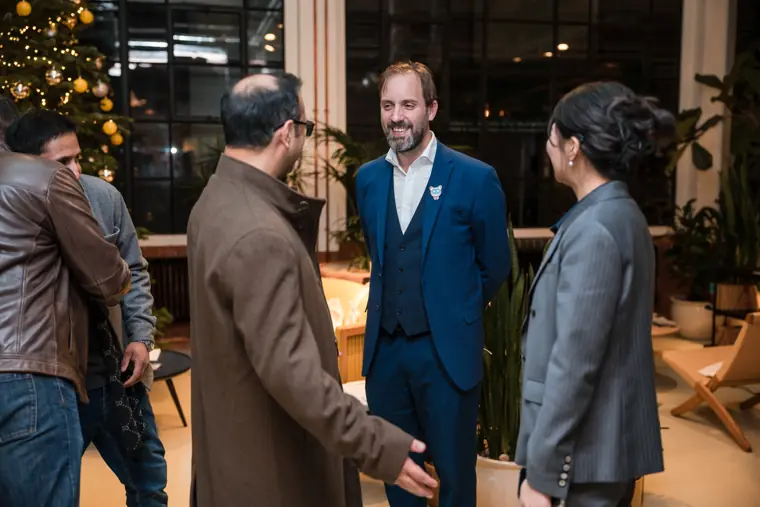 Guest greeting a team member at the venue.