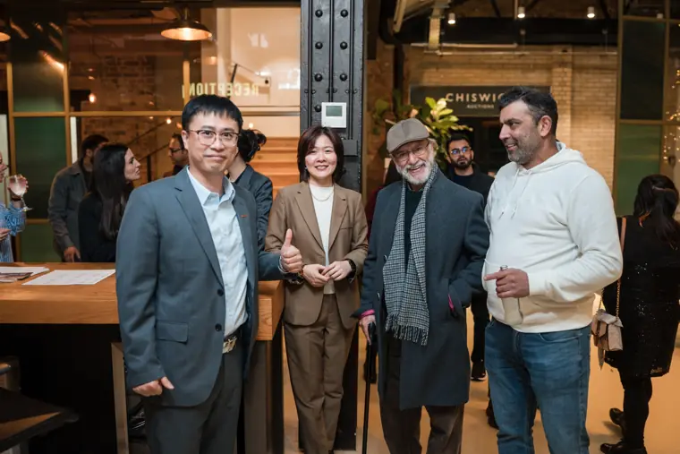 Four attendees posing together during the evening.