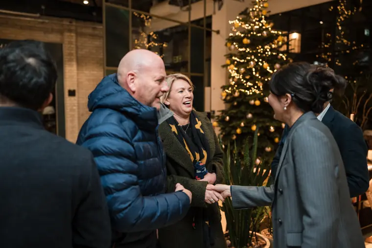 Guests meeting near the venue entrance.