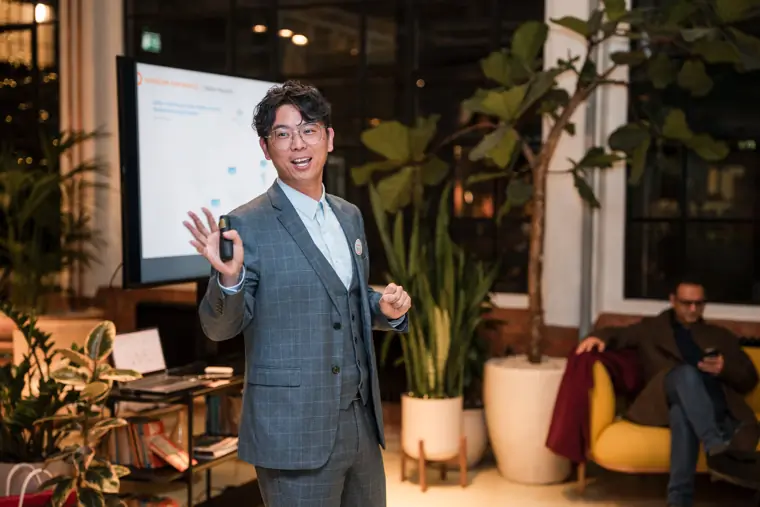 Sungrow representative speaking beside the presentation screen.