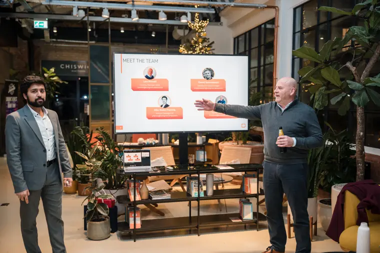Product demonstration beside the presentation screen.