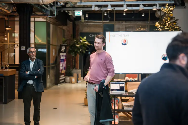Client talk with two speakers by the screen.