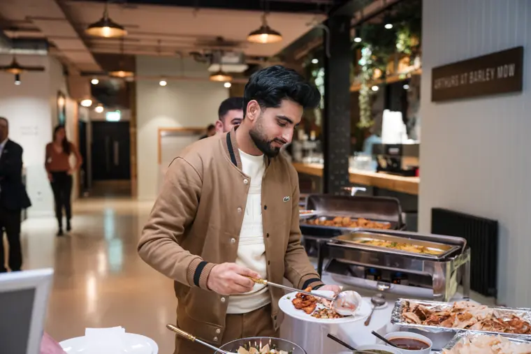 Guest collecting food during the reception.