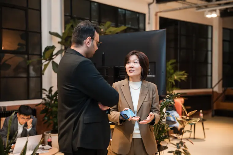Host speaking with an attendee.