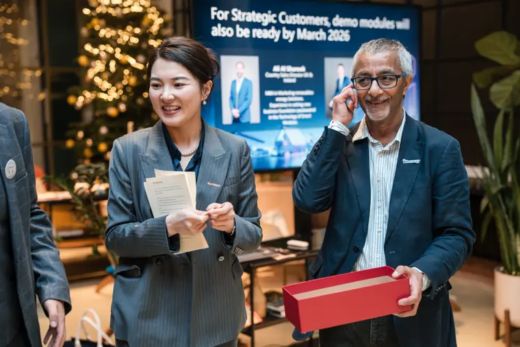 Hosts smiling during the prize presentation.