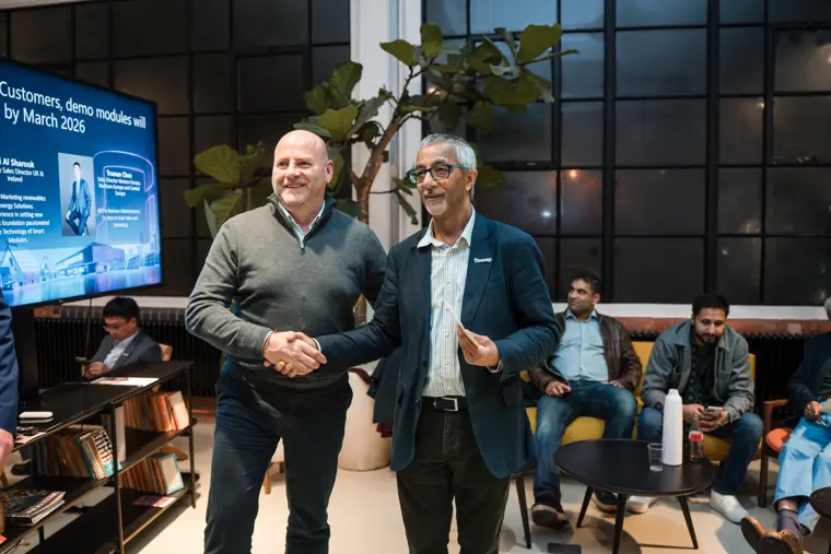 Two attendees posing together at the event.