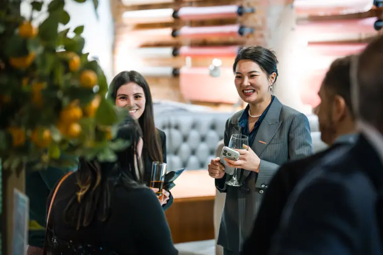 Sungrow representative speaking with guests.