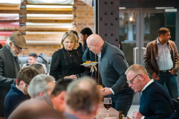 Networking continues during the meal.