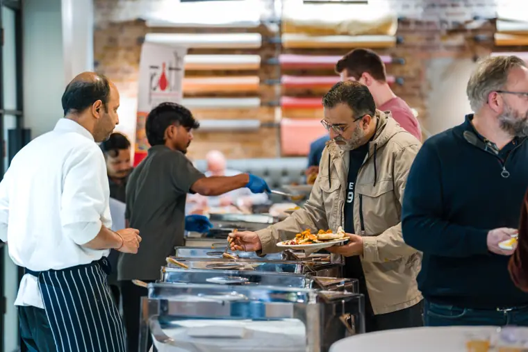 Guests choosing food from the buffet.