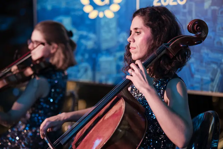 A cellist performing during the evening.