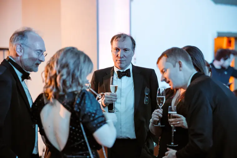 Guests talking over drinks at the awards.