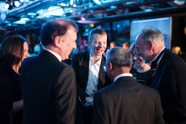 Guests in conversation at the awards reception.