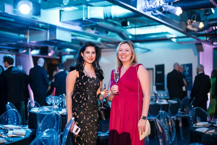 Two guests posing at the welcome reception.