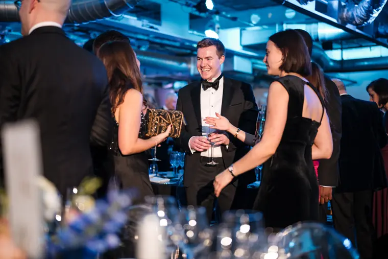 Guests sharing a conversation during the reception.