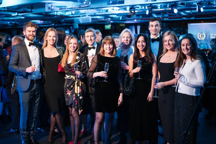 A large group of colleagues posing together.