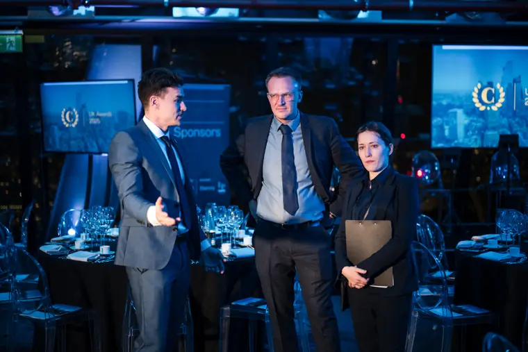 Guests posing together at the awards dinner.