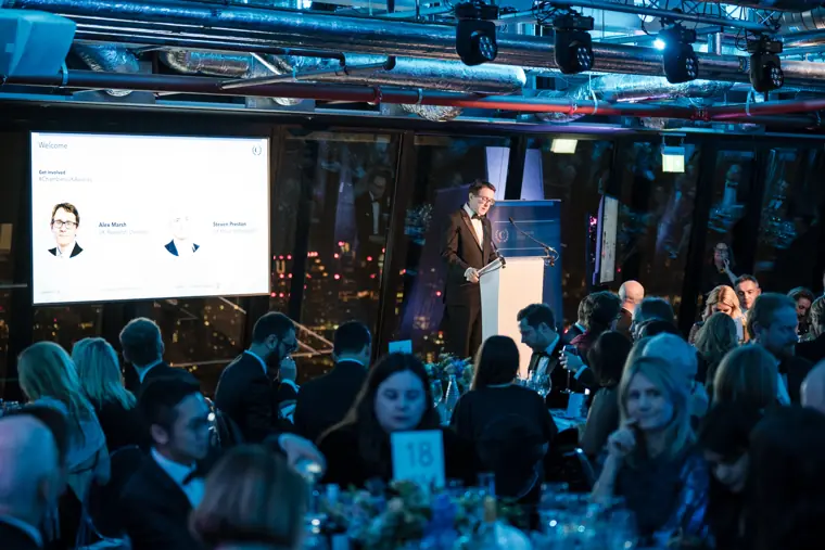 The room listening during an awards speech.