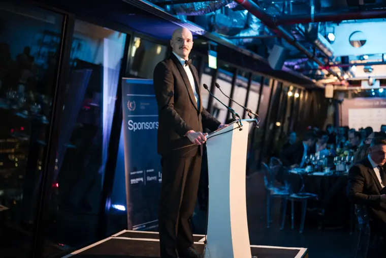 The presenter at the Chambers lectern.