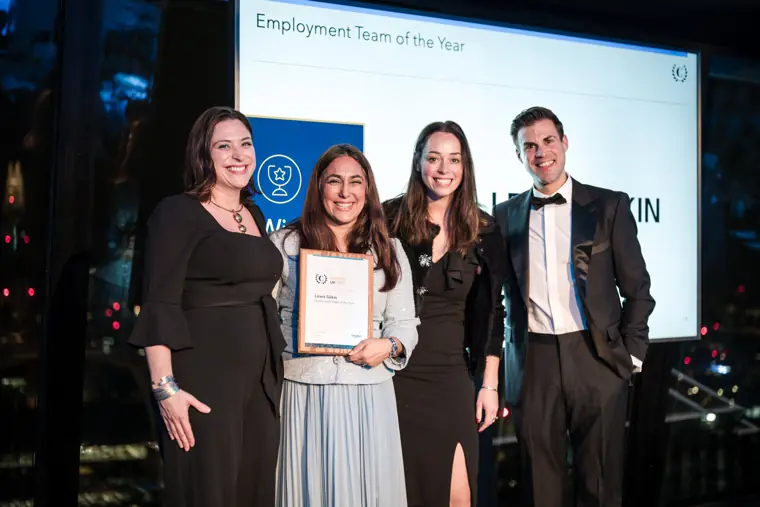 Winners posing together with their certificate.