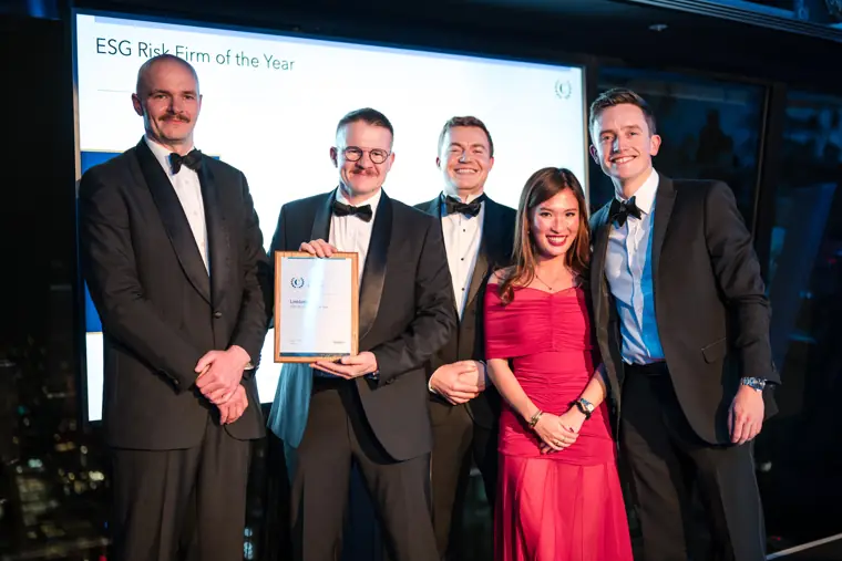 A group of award winners on stage.