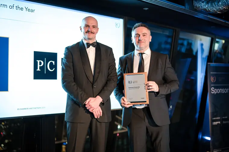 A winner with an award certificate.